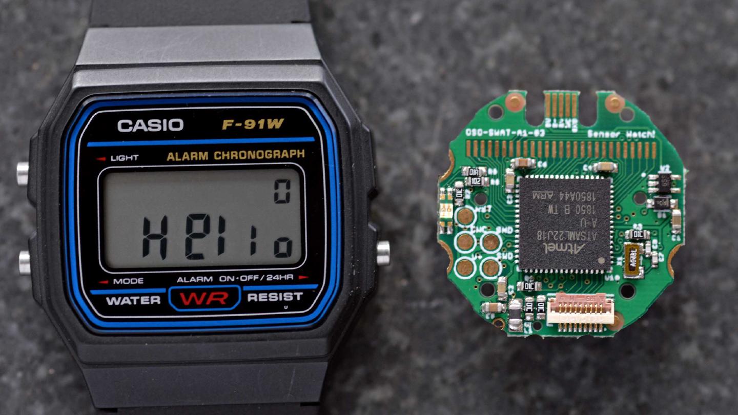 photograph of a Casio digital watch and the Sensor Watch replacement board