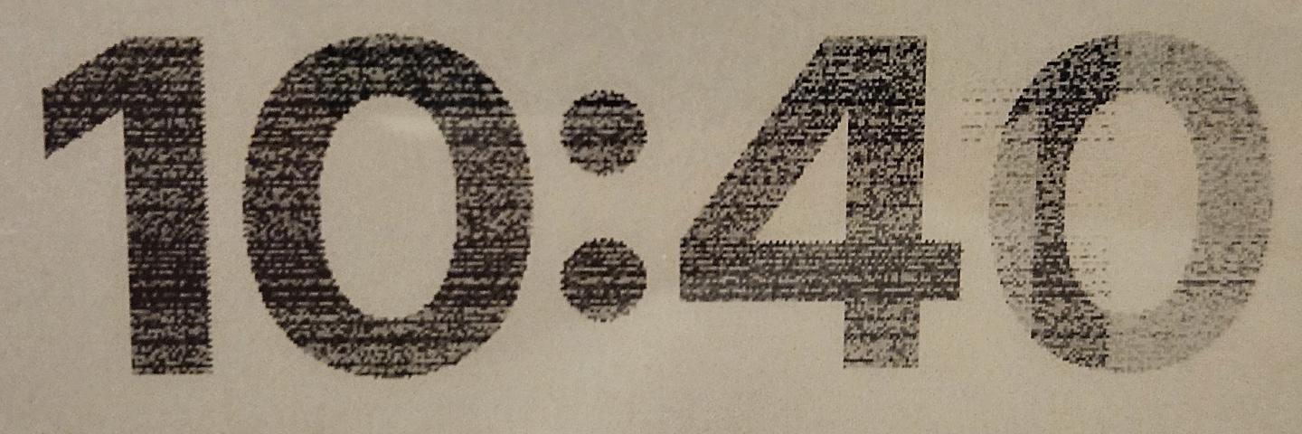 photograph of epaper showing corrupted, noisy characters